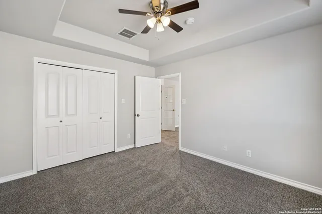 a view of a porch with wooden floor and a yard