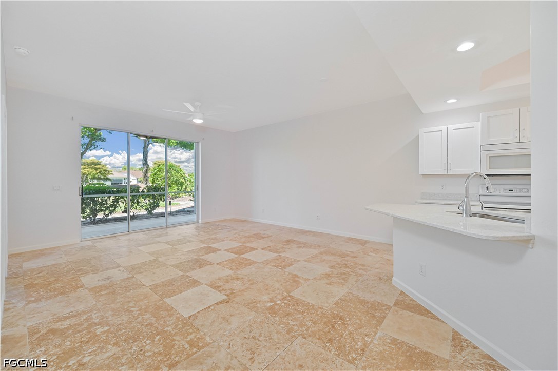 14967 Rivers Edge Court, Unit B1 Fort Myers, FL 33908 - Photo 11 of 36 a view of an empty room with a window