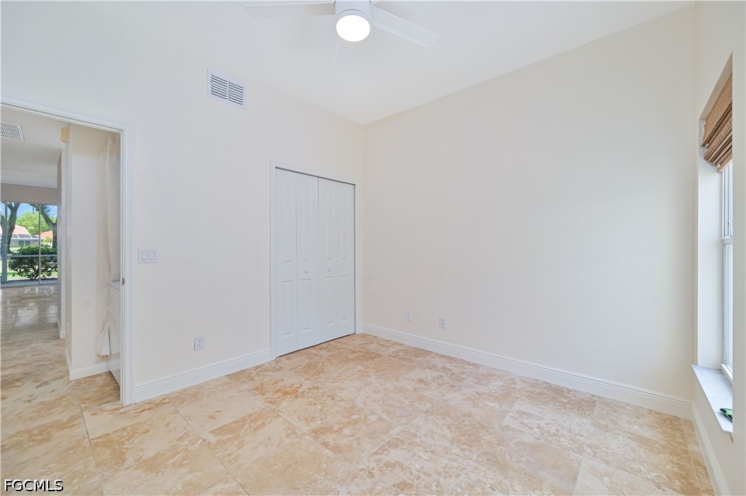 14967 Rivers Edge Court, Unit B1 Fort Myers, FL 33908 - Photo 18 of 36 an empty room with windows