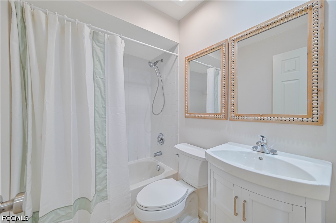 14967 Rivers Edge Court, Unit B1 Fort Myers, FL 33908 - Photo 19 of 36 a white toilet sitting next to a bathroom sink