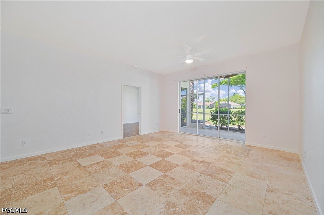 14967 Rivers Edge Court, Unit B1 Fort Myers, FL 33908 - Photo 2 of 36 a view of an empty room with a window