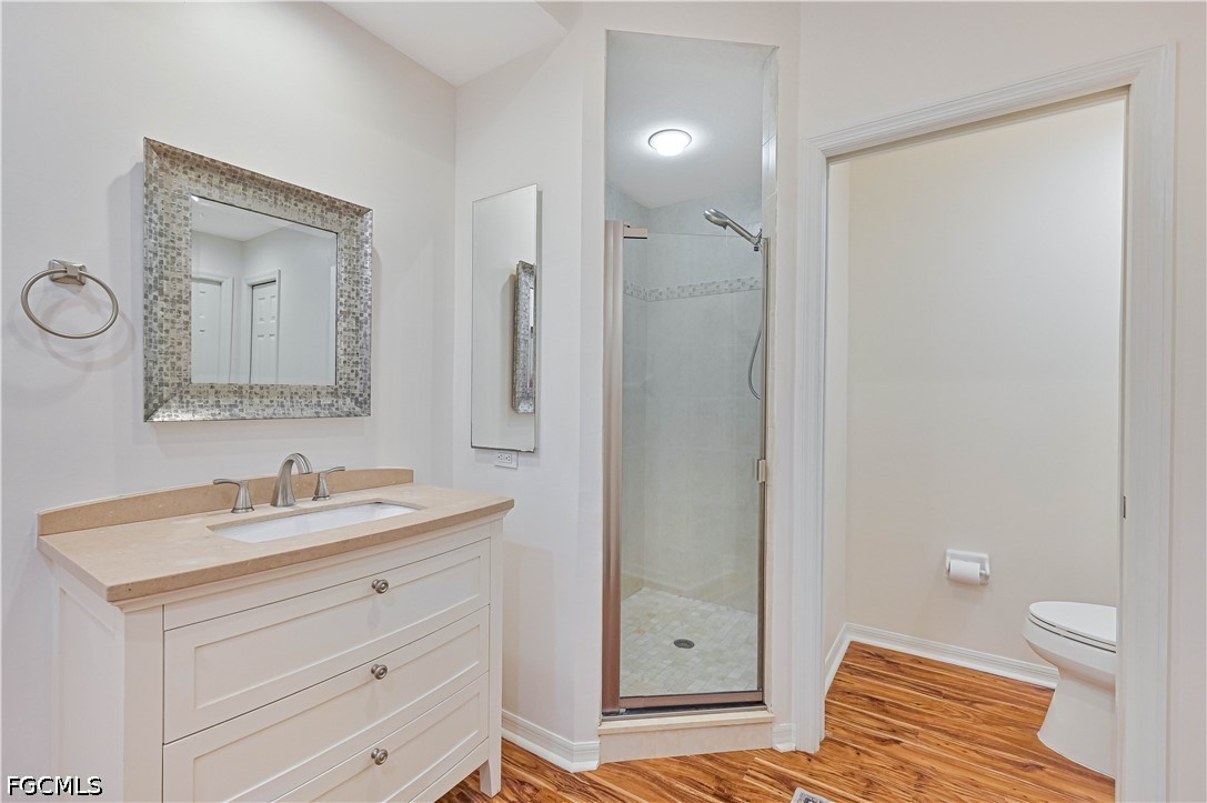 14967 Rivers Edge Court, Unit B1 Fort Myers, FL 33908 - Photo 25 of 36 a bathroom with a sink a toilet and shower