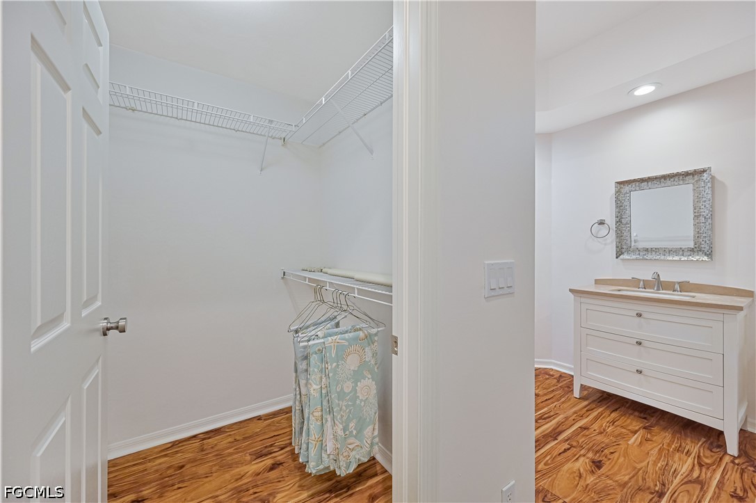 14967 Rivers Edge Court, Unit B1 Fort Myers, FL 33908 - Photo 26 of 36 a bathroom with a sink vanity and mirror