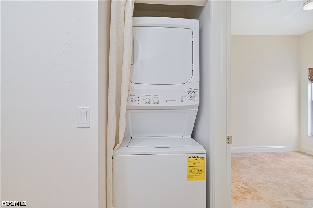 14967 Rivers Edge Court, Unit B1 Fort Myers, FL 33908 - Photo 27 of 36 a utility room with dryer and washer