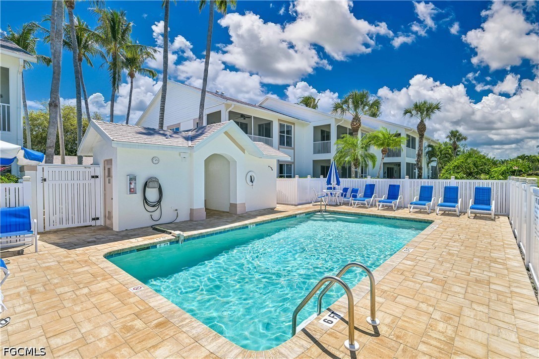 14967 Rivers Edge Court, Unit B1 Fort Myers, FL 33908 - Photo 30 of 36 a front view of a house with garden