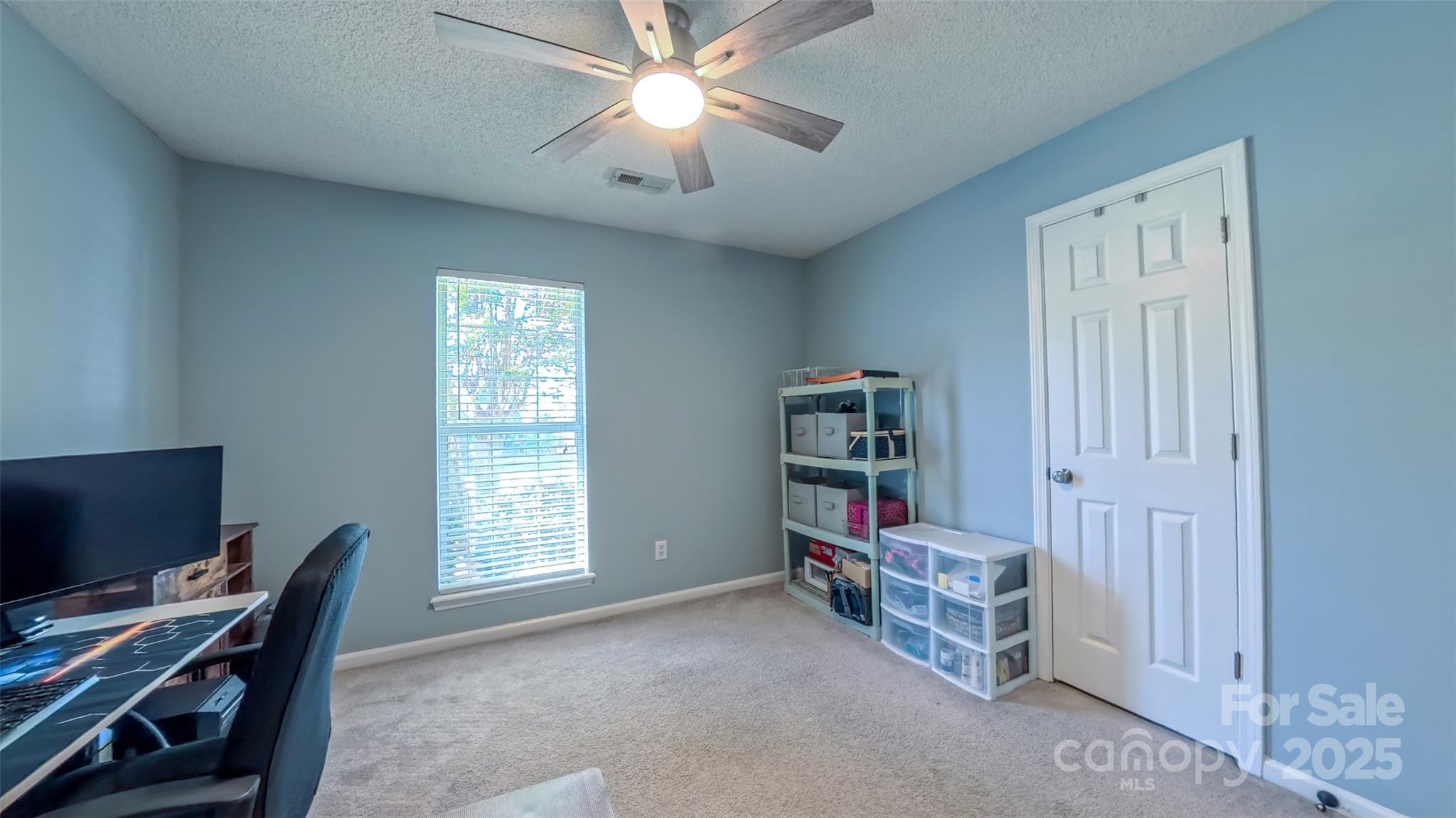 3693 Stonefield Street Southwest Concord, NC 28027 - Photo 19 of 27 a view of a workspace with furniture and a window