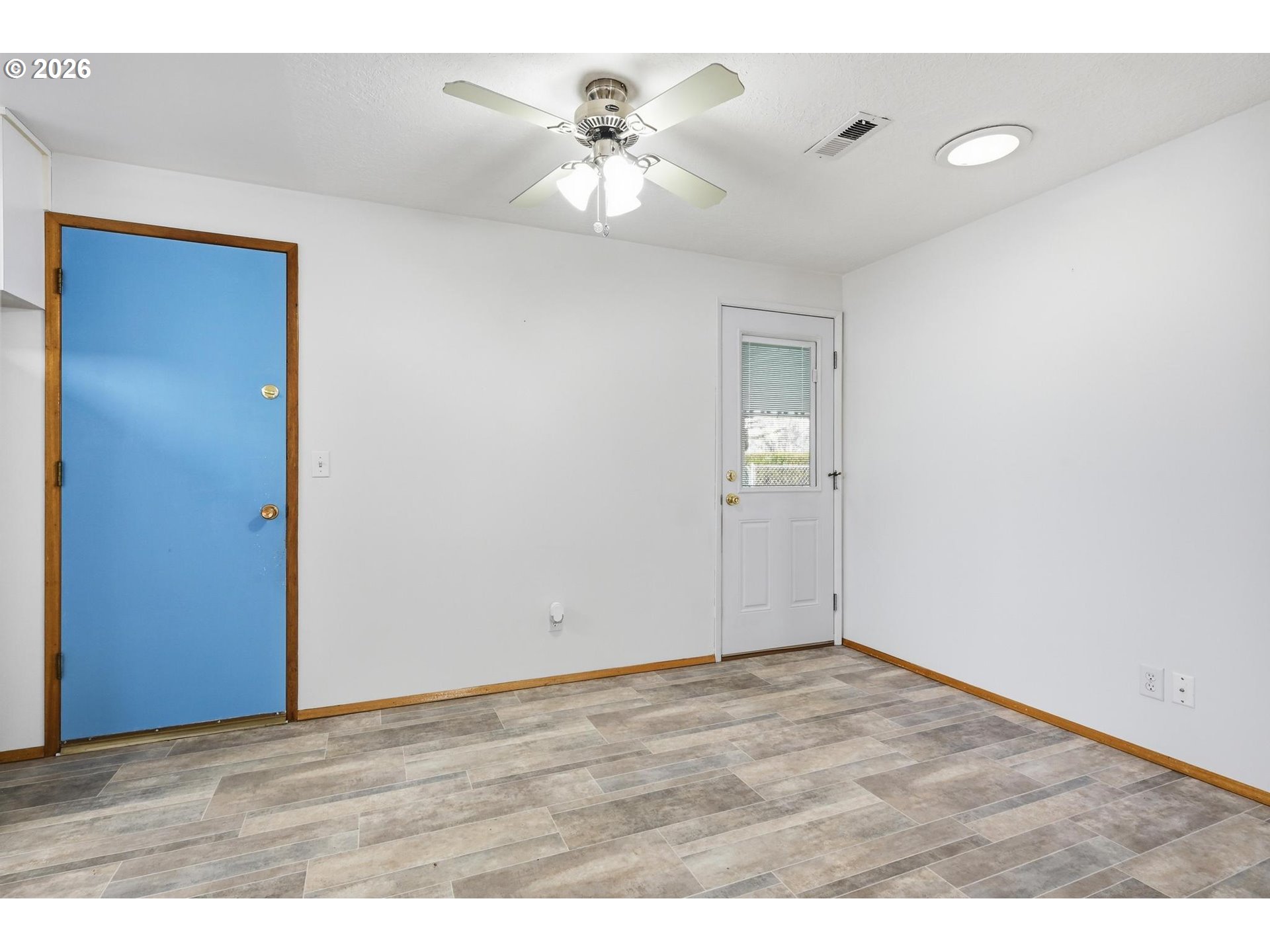 1720 Jansen Way Woodburn, OR 97071 - Photo 9 of 41 a view of an empty room with a window