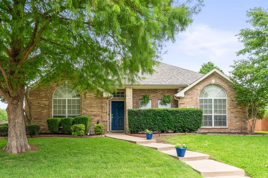205 Crepe Myrtle Lane Murphy, TX 75094 - Photo 1 of 33 a front view of a house with a yard and trees