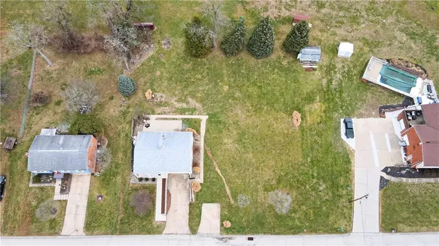 an aerial view of residential house with outdoor space