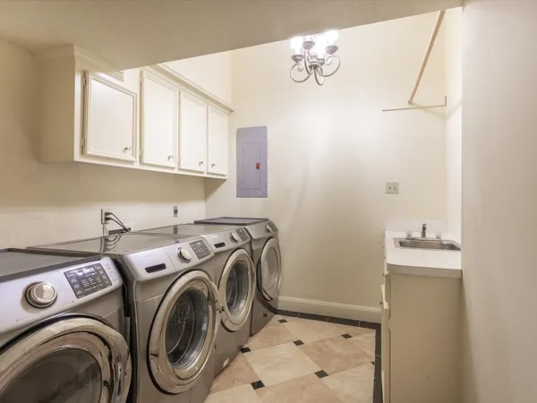 a kitchen with stainless steel appliances granite countertop a sink and cabinets