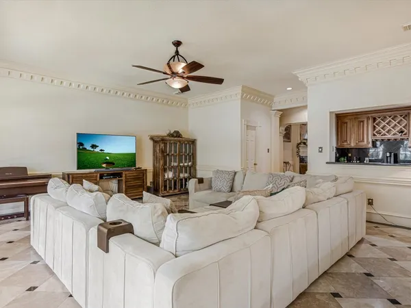 a kitchen with a table chairs sink and cabinets