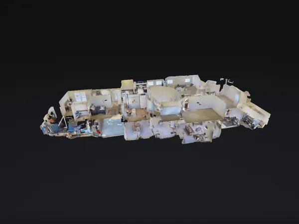 a bed sitting in a bedroom next to a wall