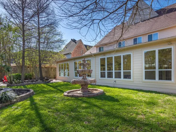 a dining room with furniture a rug and wooden floor