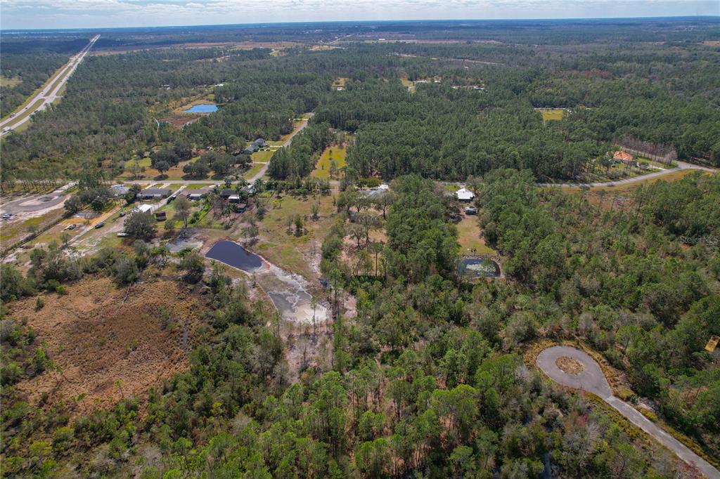 208 Limpkin Lane Frostproof, FL 33843 - Photo 48 of 60 an aerial view of residential house and green space