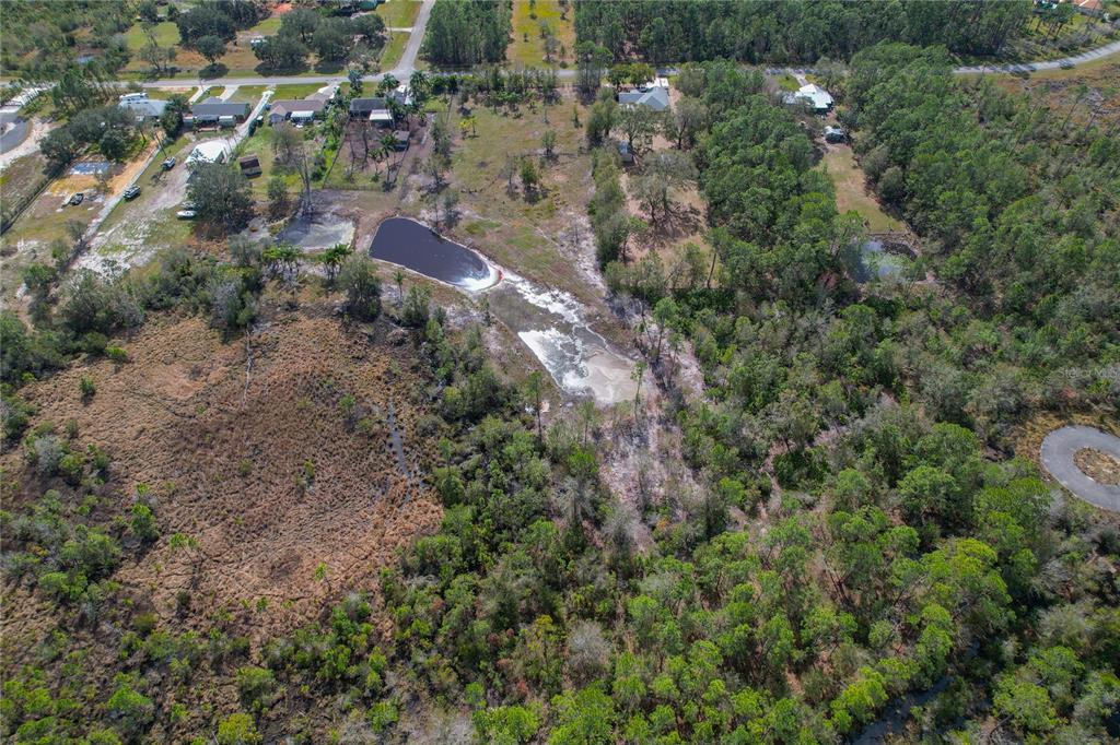 208 Limpkin Lane Frostproof, FL 33843 - Photo 55 of 60 an aerial view of residential house with outdoor space and trees all around