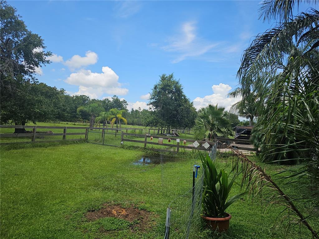 208 Limpkin Lane Frostproof, FL 33843 - Photo 7 of 60 a view of a golf course with a lake