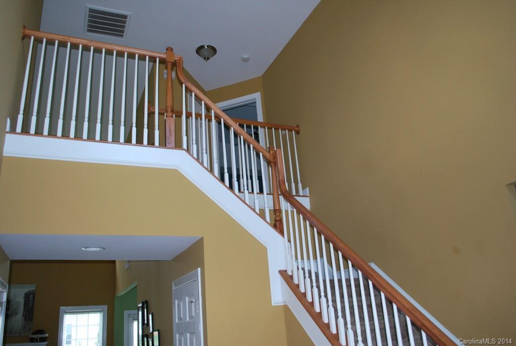 8612 Ridgeline Lane Charlotte, NC 28269 - Photo 2 of 20 a view of staircase with railing and a window