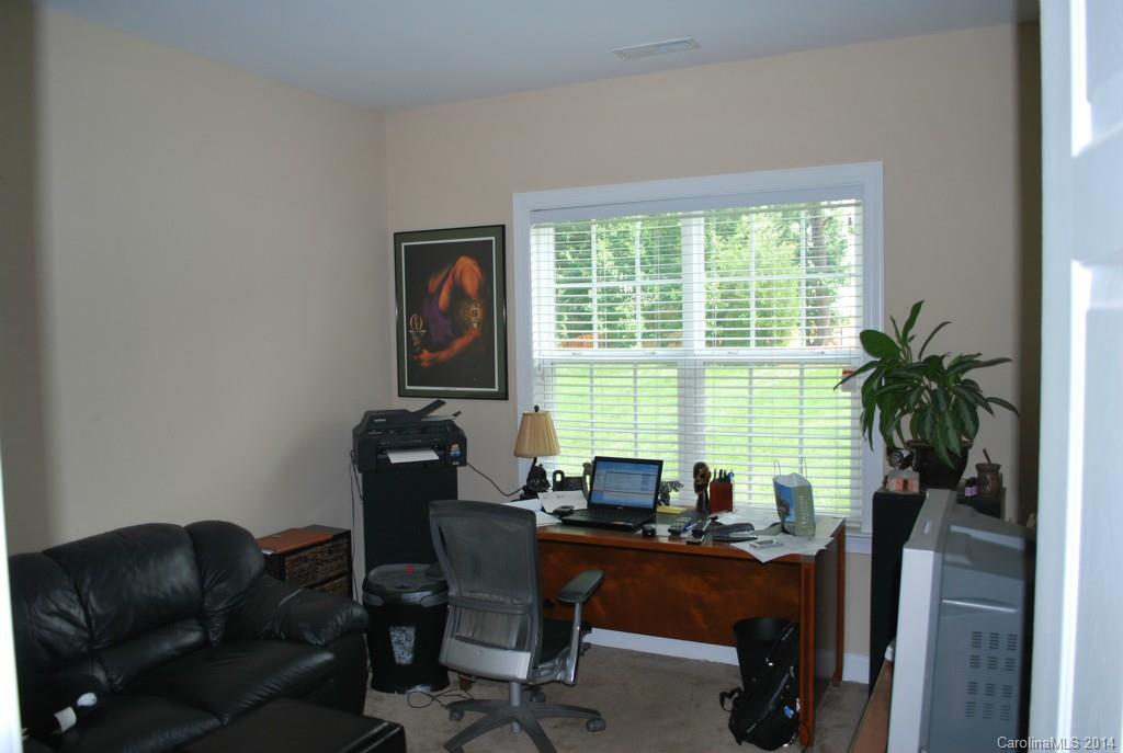 8612 Ridgeline Lane Charlotte, NC 28269 - Photo 14 of 20 a work room with furniture and a window