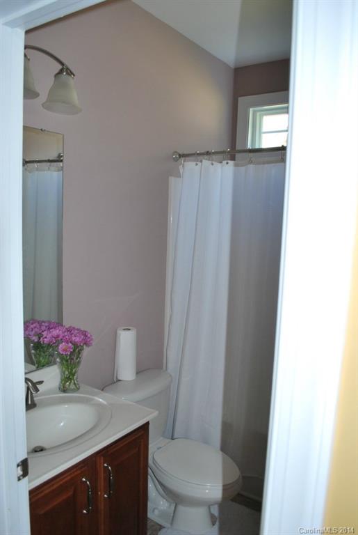 8612 Ridgeline Lane Charlotte, NC 28269 - Photo 15 of 20 a bathroom with a sink and a mirror