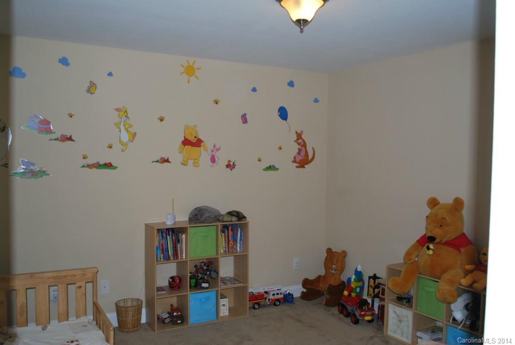 8612 Ridgeline Lane Charlotte, NC 28269 - Photo 16 of 20 a room with toys and wooden floor