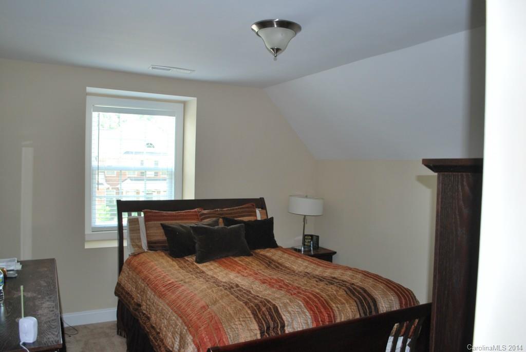 8612 Ridgeline Lane Charlotte, NC 28269 - Photo 19 of 20 a bedroom with a bed and window
