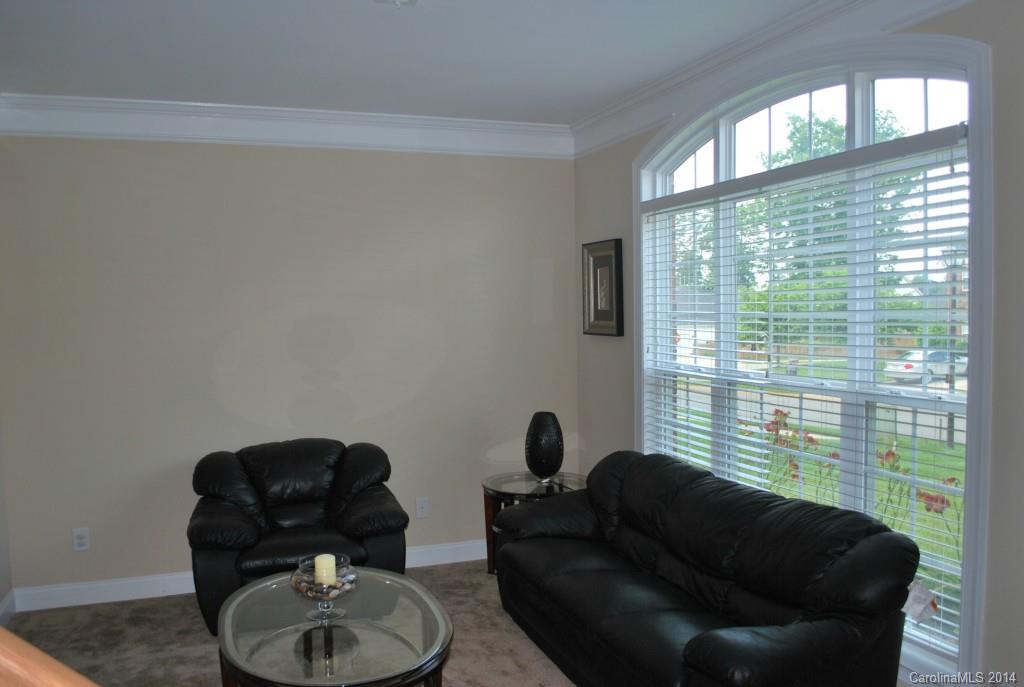 8612 Ridgeline Lane Charlotte, NC 28269 - Photo 3 of 20 a living room with furniture and a large window