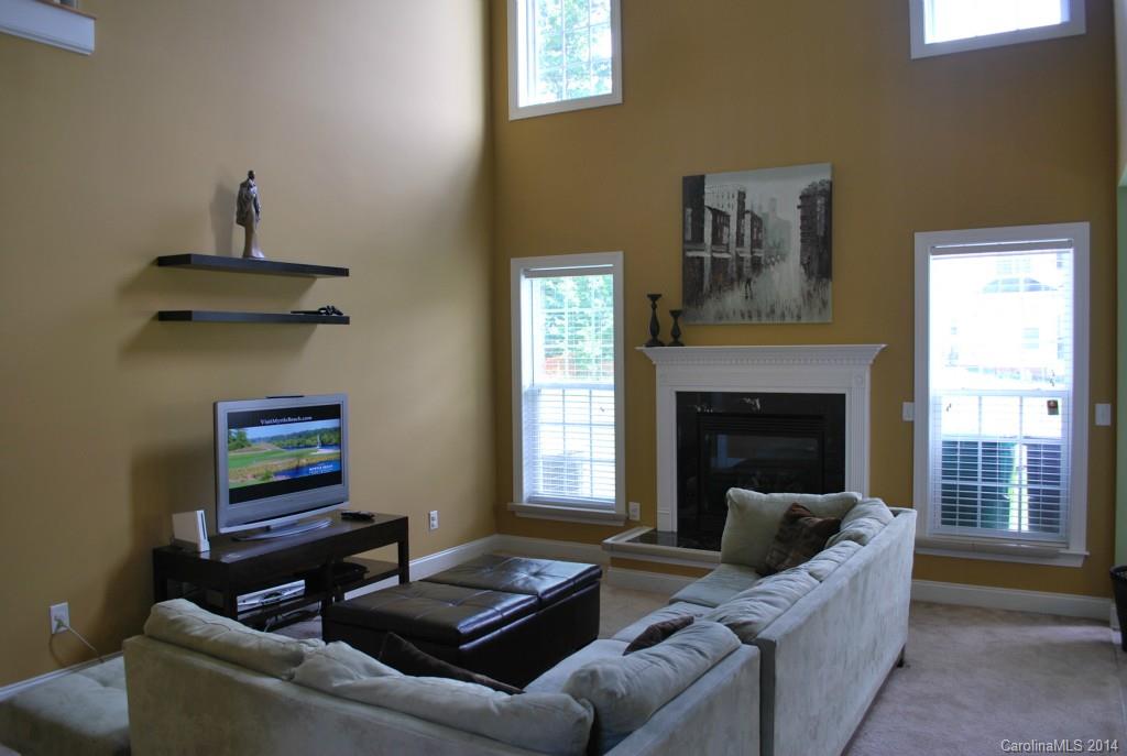 8612 Ridgeline Lane Charlotte, NC 28269 - Photo 6 of 20 a living room with furniture and a fireplace