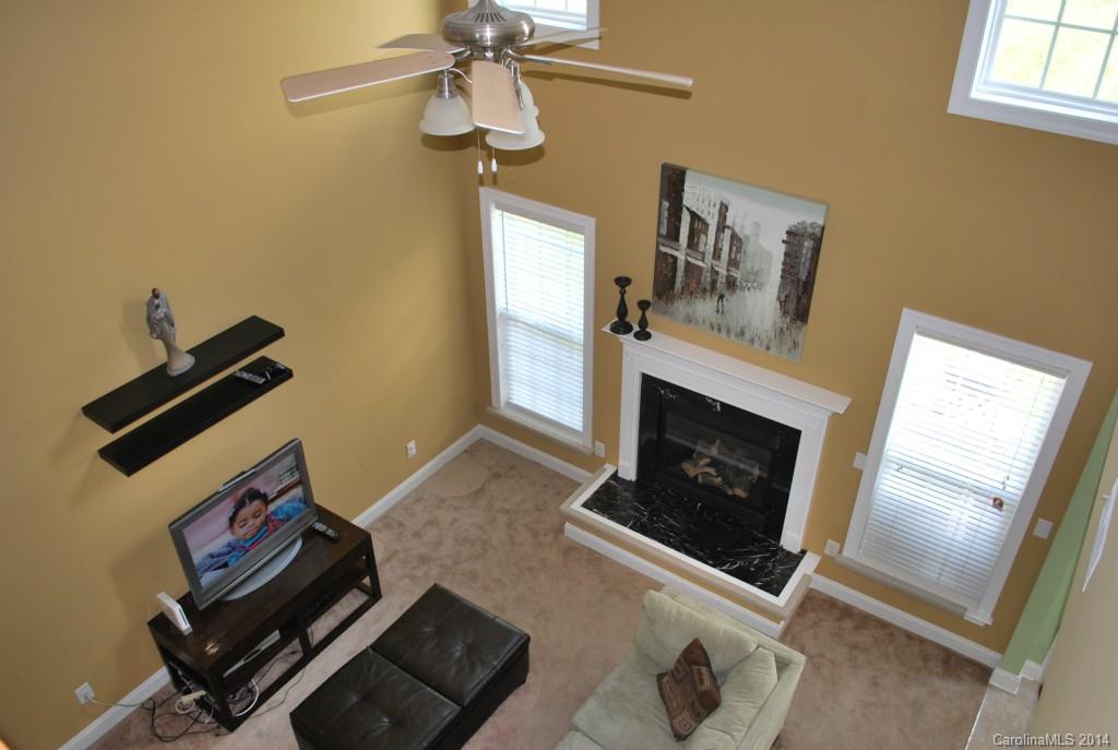 8612 Ridgeline Lane Charlotte, NC 28269 - Photo 7 of 20 a living room with furniture and a fireplace
