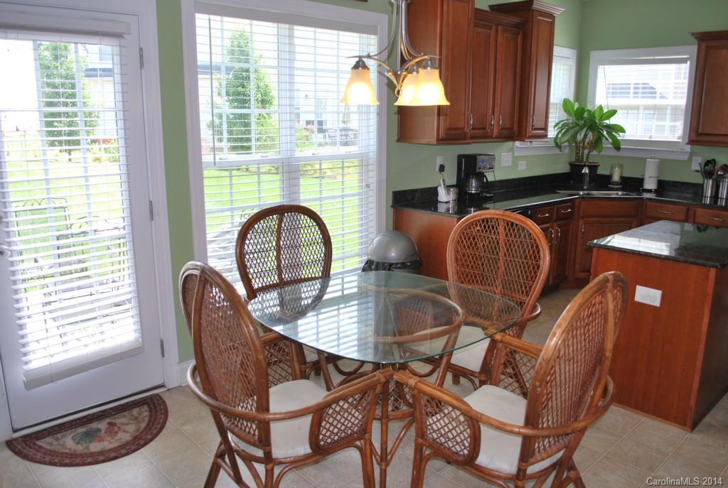 8612 Ridgeline Lane Charlotte, NC 28269 - Photo 9 of 20 a dining room with furniture and window
