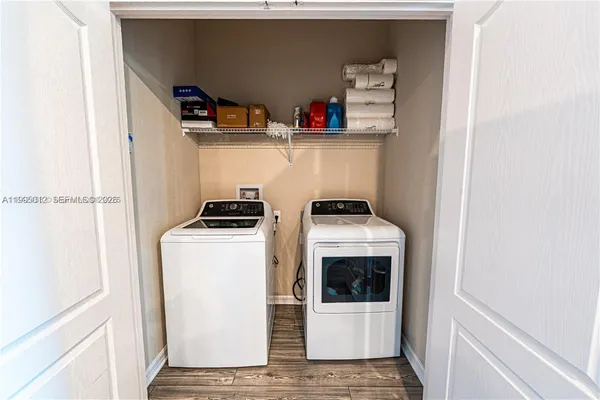 a utility room with dryer and washer