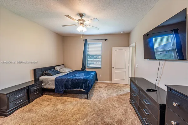 a bedroom with furniture and window