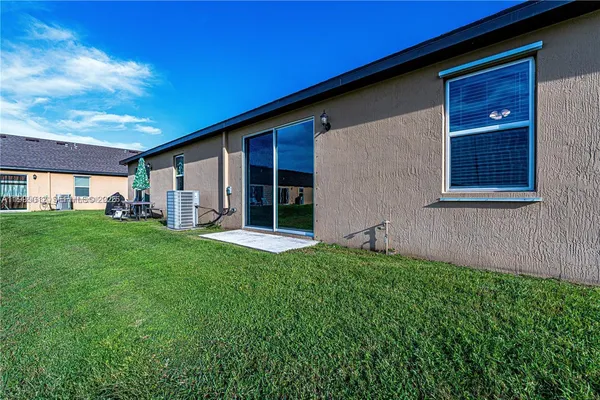 a backyard of a house with lots of green space
