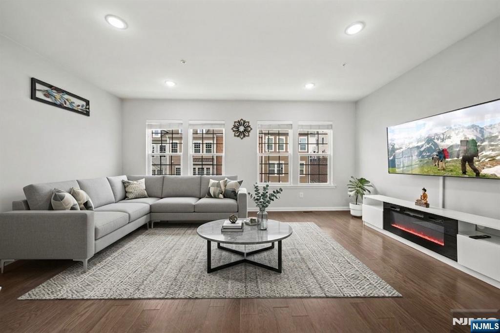129 Truman Drive Wood-Ridge, NJ 07075 - Photo 1 of 47 a living room with furniture and a flat screen tv