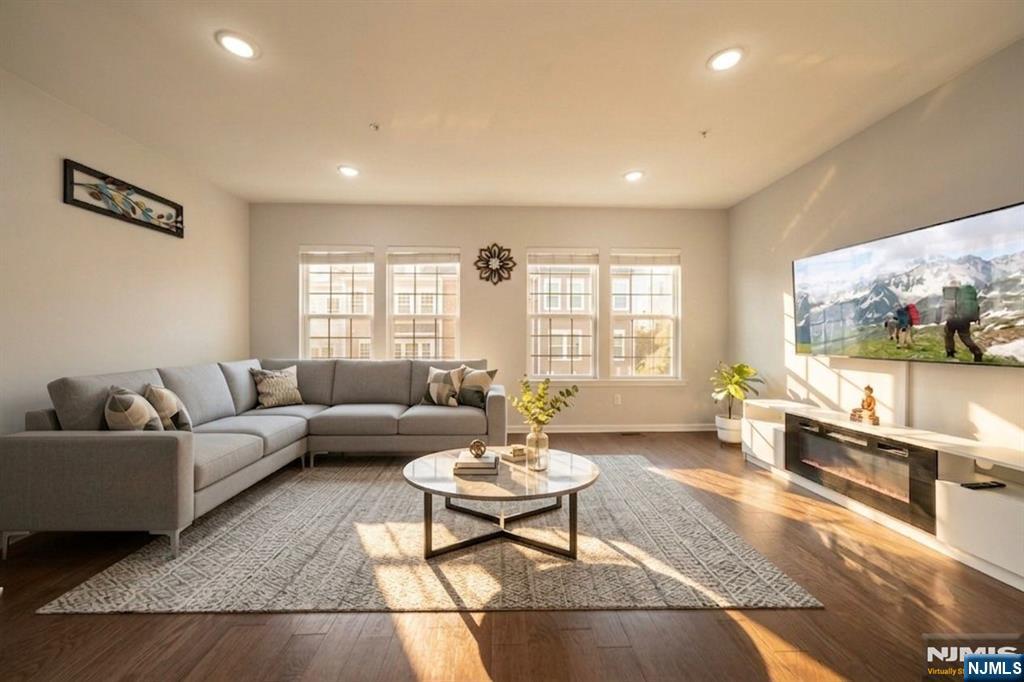 129 Truman Drive Wood-Ridge, NJ 07075 - Photo 12 of 47 a living room with furniture and a flat screen tv