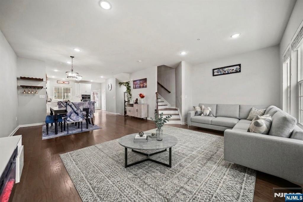 129 Truman Drive Wood-Ridge, NJ 07075 - Photo 13 of 47 a living room with furniture and wooden floor
