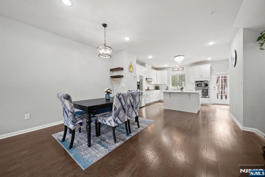 129 Truman Drive Wood-Ridge, NJ 07075 - Photo 14 of 47 a view of a dining room with furniture and wooden floor