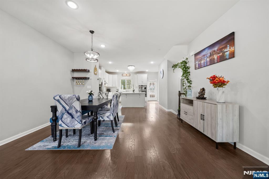 129 Truman Drive Wood-Ridge, NJ 07075 - Photo 15 of 47 a dining room with furniture entryway and wooden floor
