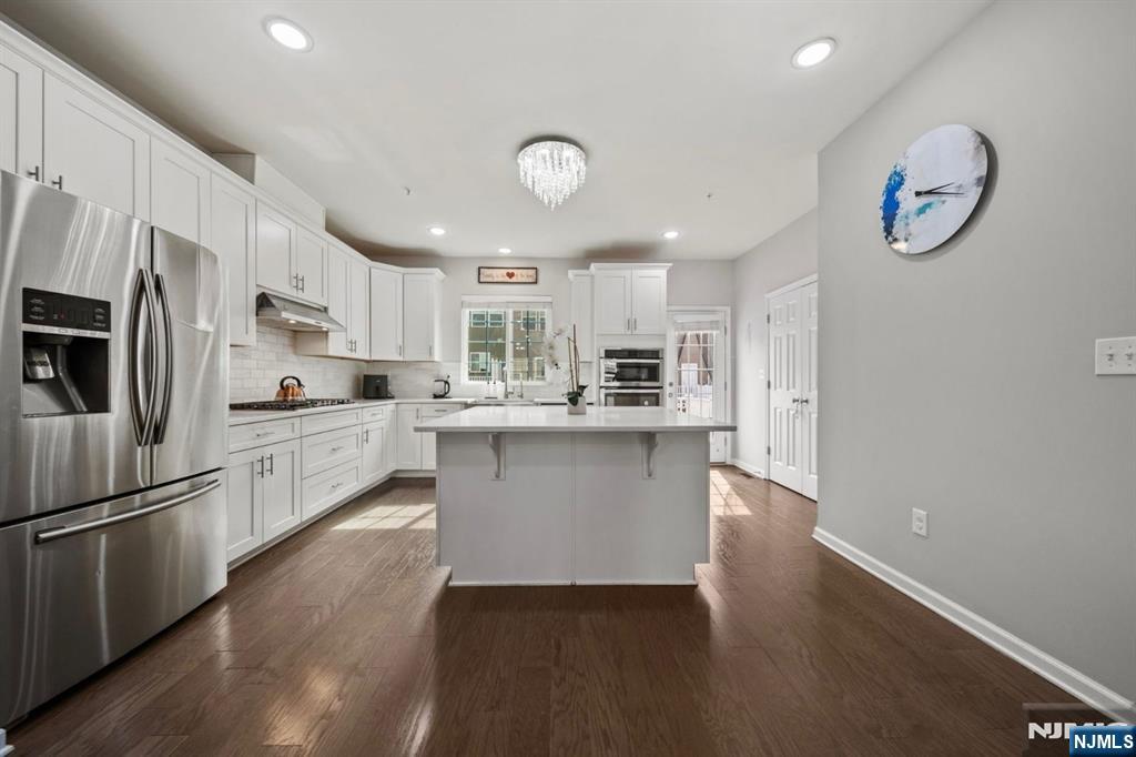 129 Truman Drive Wood-Ridge, NJ 07075 - Photo 17 of 47 a kitchen with a refrigerator and a sink