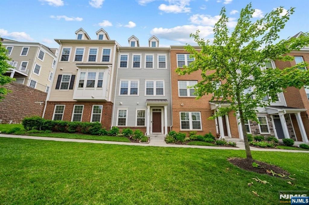 129 Truman Drive Wood-Ridge, NJ 07075 - Photo 2 of 47 a front view of a house with a yard