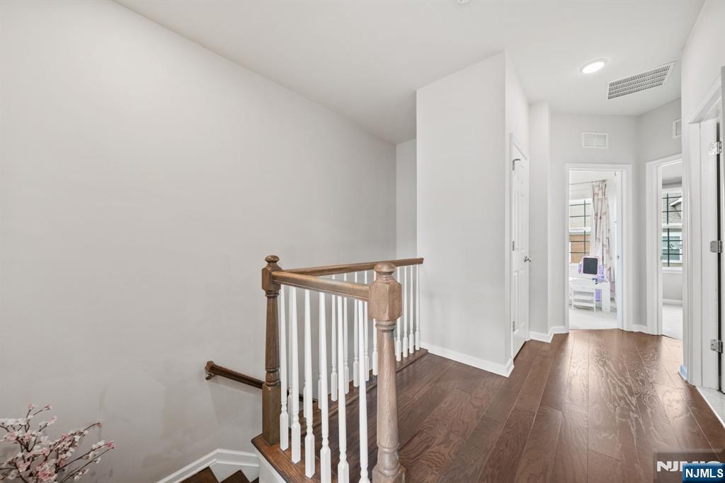 129 Truman Drive Wood-Ridge, NJ 07075 - Photo 22 of 47 a view of a hallway with wooden floor