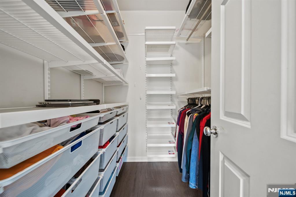 129 Truman Drive Wood-Ridge, NJ 07075 - Photo 26 of 47 a view of walk in closet with clothes and shoes