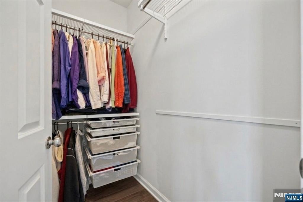 129 Truman Drive Wood-Ridge, NJ 07075 - Photo 27 of 47 a view of walk in closet with clothes