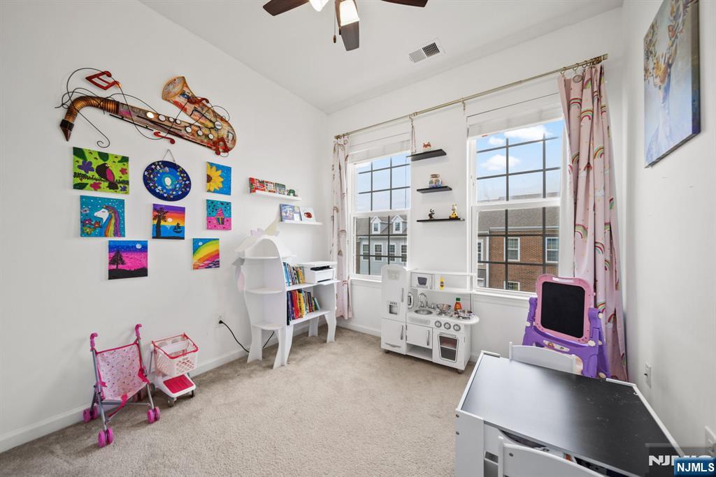 129 Truman Drive Wood-Ridge, NJ 07075 - Photo 31 of 47 a bedroom with furniture a bed and a window