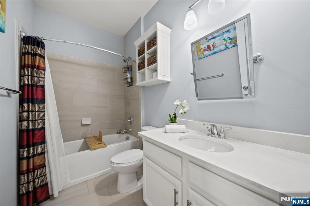 129 Truman Drive Wood-Ridge, NJ 07075 - Photo 32 of 47 a bathroom with a sink toilet and shower