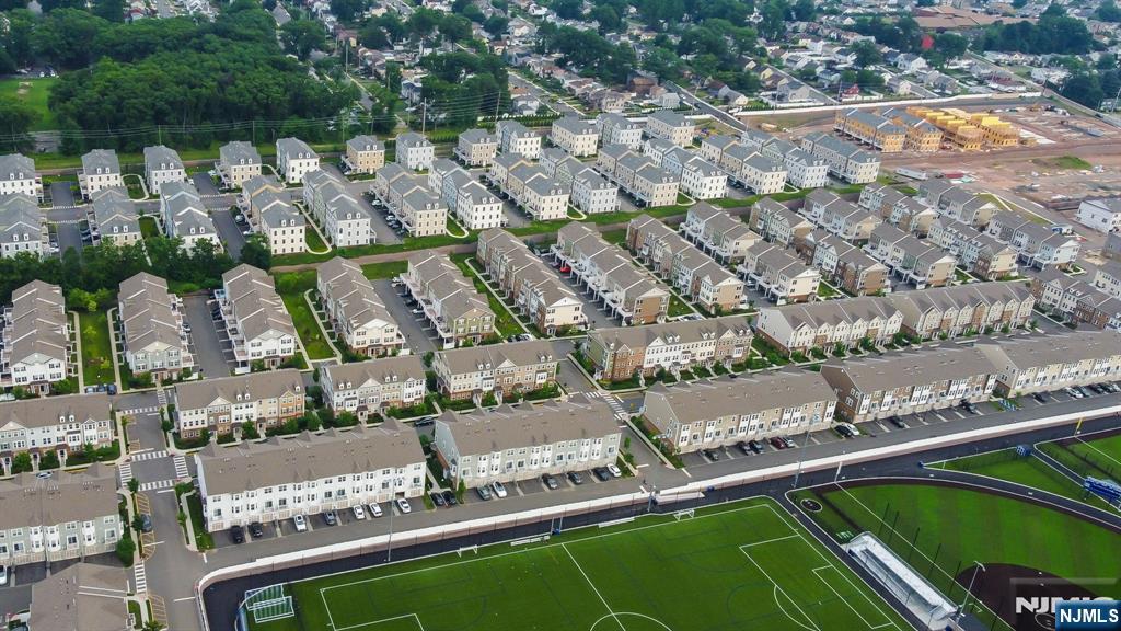129 Truman Drive Wood-Ridge, NJ 07075 - Photo 46 of 47 a view of swimming pool with a yard and plants