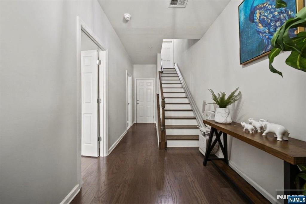 129 Truman Drive Wood-Ridge, NJ 07075 - Photo 5 of 47 a hallway with wooden floor