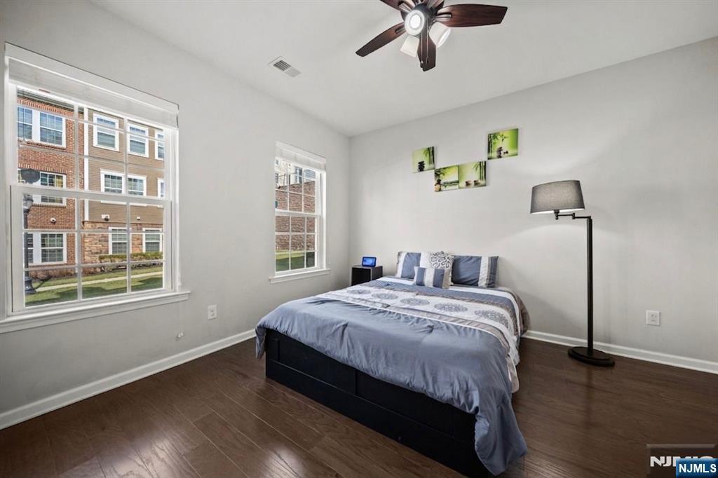 129 Truman Drive Wood-Ridge, NJ 07075 - Photo 6 of 47 a bedroom with a bed and wooden floor