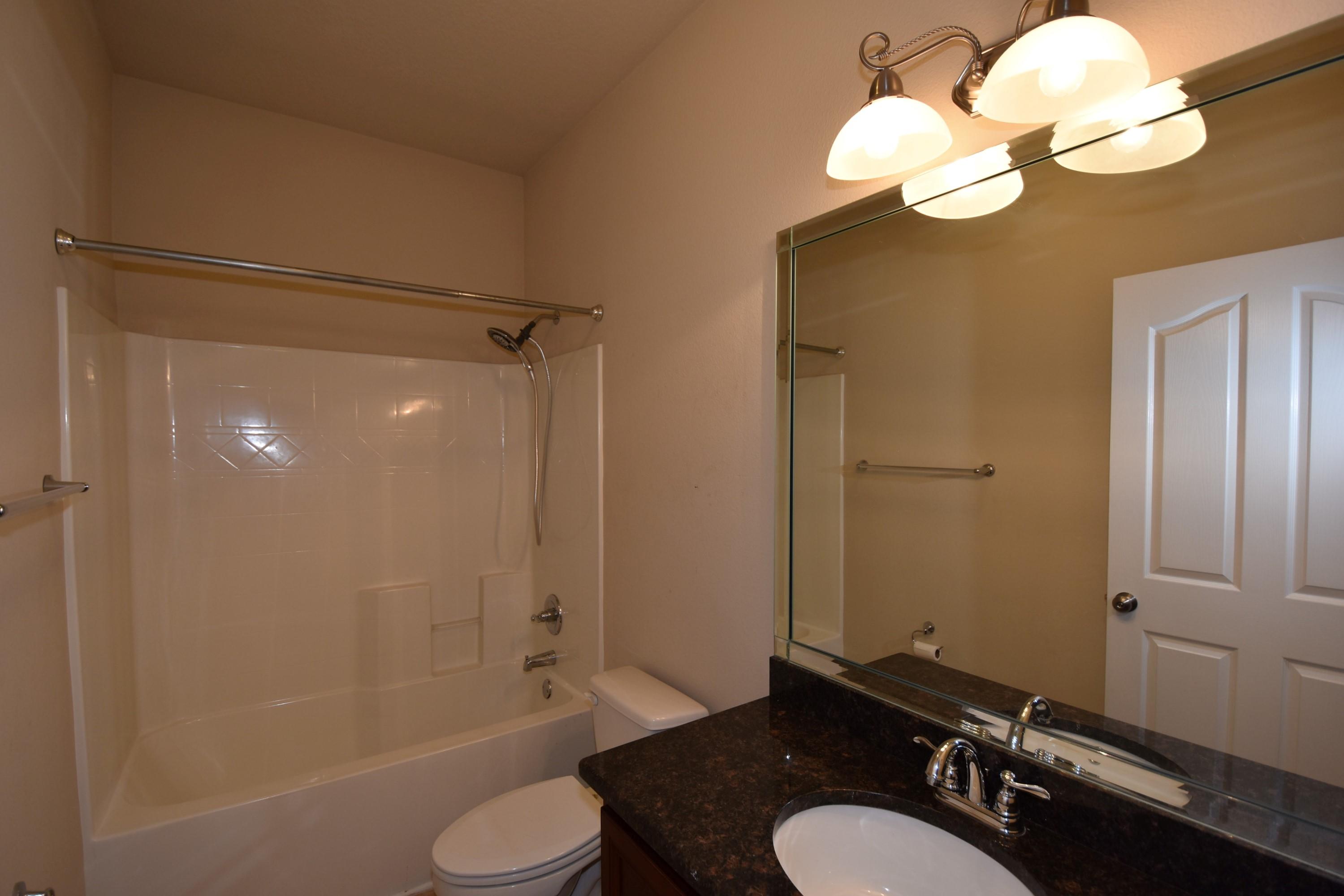 622 Red Fern Road Crestview, FL 32536 - Photo 29 of 37 a bathroom with a sink a toilet and shower