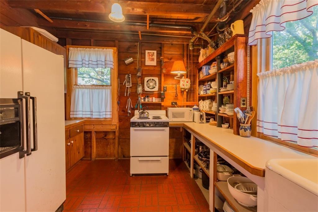 12 Chandler Road Boothbay, ME 04537 - Photo 9 of 16 The kitchen with open shelving and...