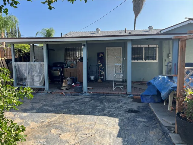 a view of a backyard with sitting area